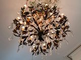 a chandelier that is hanging from the ceiling