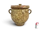 a brown vase with a lid on a white background