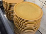 a lot of plates stacked on the counter in the kitchen