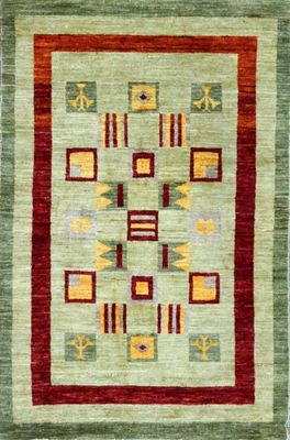 a green and red rug with geometric designs on it