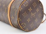 a close up of a louis vuitton bag on a white surface