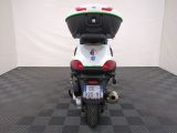 a motorcycle with a helmet on the back of it