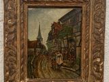 peinture représentant une scène de rue avec une calèche, posée sur une table en bois