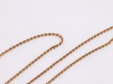 a gold chain necklace with a heart shaped pendant on a white background