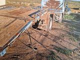 a truck that is sitting in the dirt in the field