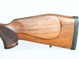 a close up of a rifle on a white background