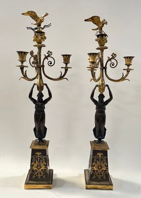 pair of antique brass and bronze candelabs with birds on them