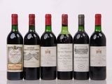 six bouteilles de vin sont alignées sur une table