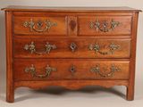 an image of a wooden chest of drawers with ornate handles