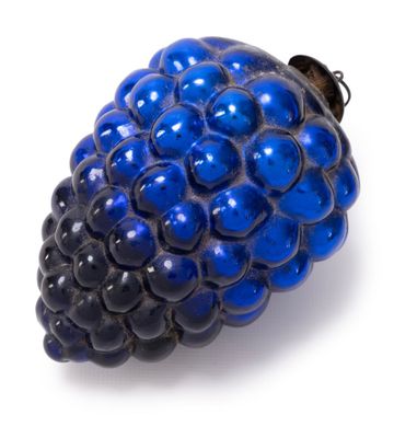 a close up of a blue blackberry on a white surface