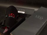 a black box with a pair of shoes inside of it