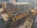 a large tank that is sitting in the dirt