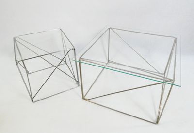 these are two glass tables that are sitting on a white surface