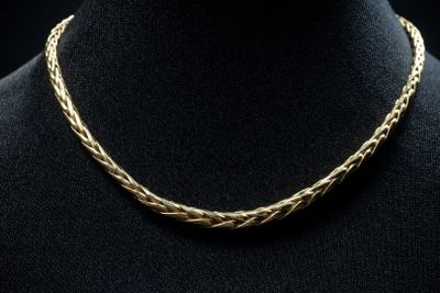 a gold necklace on a mannequin mannequin mannequin mannequin mannequin mannequin mannequin mannequin mannequin