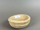 an image of a small bowl sitting on top of a table