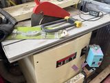 a picture of a table with a saw on it