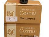 boxes stacked on top of each other with a bottle of wine on top of them