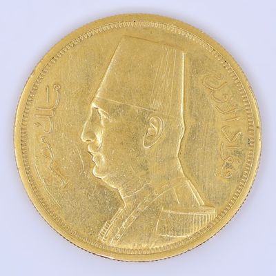 l'image d'une pièce d'or sur laquelle figure le visage d'un homme