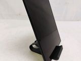 a tablet that is sitting on a stand on a table