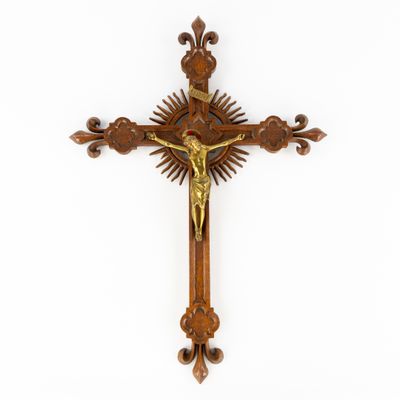 a wooden cross with a crucif on it against a white background