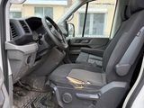 the interior of a van with the door open and the driver ' s seat down