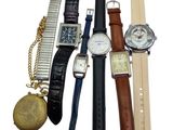 a lot of watches that are sitting together on a table