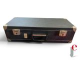 a black suitcase that is sitting on a white surface