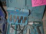 a blue case with tools in it on the floor