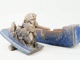 two pieces of pottery that are sitting on top of each other