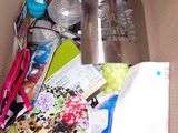 a cardboard box filled with assorted items and a toothbrush