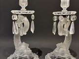 pair of clear glass candlesticks with crystal drops on each of them