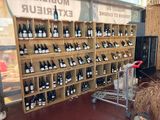 many bottles of wine on the shelves in the store