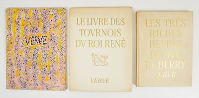 three books are lined up on a wall with a white background