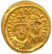une pièce d'or portant l'image d'un homme et d'une femme