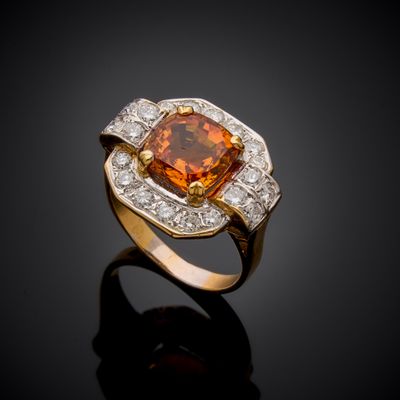 an orange sapphire and diamond ring