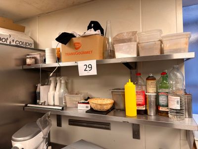 a kitchen with a lot of food on the shelves