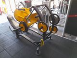 yellow and black gym equipment in a gym with a black floor
