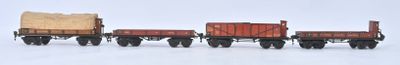 four toy trains that are lined up in a row
