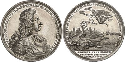 a close up of a silver coin with a woman on it