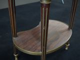 a small table with a clock on top of it