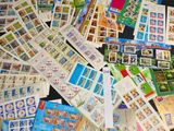 a lot of stamps on a black surface