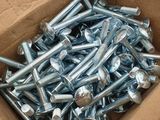a box full of screws and nuts on a table
