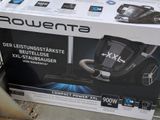 a box that has a vacuum in it on the floor