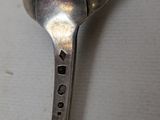 a spoon that has a hole in the middle of it