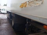 two trucks that are parked next to each other