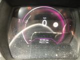 a car dashboard with a speedometer and a clock on it