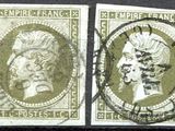 a couple of stamps that are sitting on top of a table
