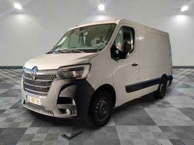 a white van that is parked on a checkered floor