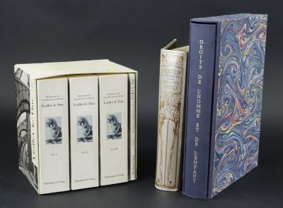 two books are sitting next to each other on a table