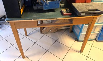 a table that has a bunch of tools on top of it